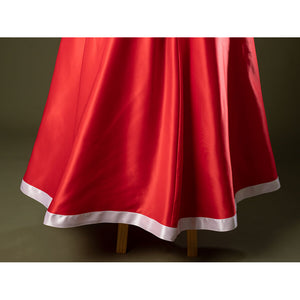 Close-up of Charlie Morningstar prom dress hem with flared red satin skirt, white trim and smooth finish