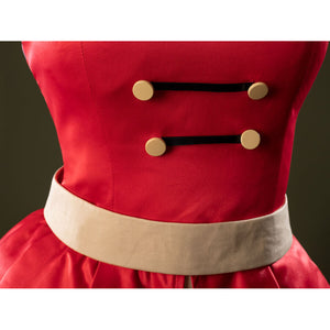 Detail of Charlie Morningstar prom dress waist with beige waistband, black bands and four gold front buttons