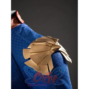 The Boys Homelander cosplay shoulder armor detail stacks gold-tone plates over textured blue fabric.