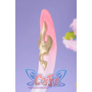 Honkai: Star Rail Evanescia cosplay bunny ear detail shows pink plush texture edged by gold-tone ornament