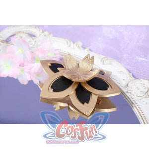 Honkai: Star Rail Evanescia cosplay flower arm accessory close-up highlights gold-tone petals on a black strap