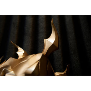 Honkai Star Rail Khaslana cosplay shoulder armor detail highlights the curved gold-tone spike