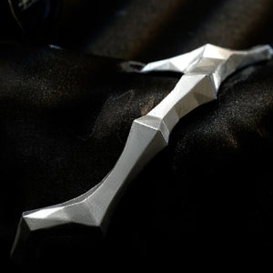 Honkai Star Rail Khaslana cosplay silver arm armor close-up shows an angular blade-like shape