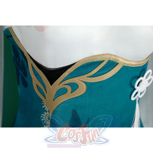 Honkai: Star Rail Ruan Mei cosplay costume bodice close-up sets gold trim against teal fabric and pale chest edging.