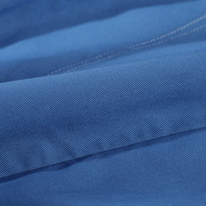 Human Torch Johnny Storm cosplay costume fabric close up reveals the dense weave of the durable blue cotton twill textile.