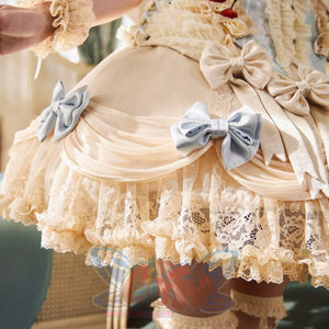 Close-up of the Lace Bow Skirt item with blue satin bows, gathered mesh, floral lace, and cream ruffles