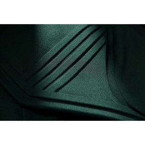 Latverian Witch cosplay costume frames dark green fabric with precise linear pleats that enhance the textured surface detail.