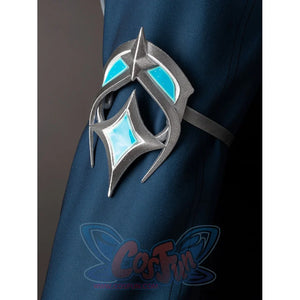 Lumine cosplay sleeve ornament close-up with silver-tone curves and turquoise insets on dark teal fabric.