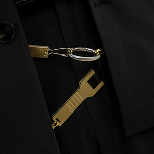 Final Fantasy XV Noctis The Chosen King cosplay costume waist ornament detail traces metal links across dark textile layers.