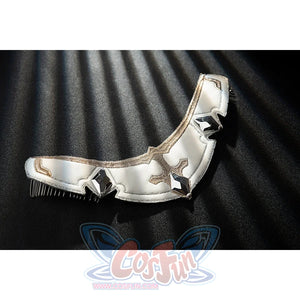Genshin Impact Noelle cosplay arm guard flat lay shows white armor segments edged in gold trim.