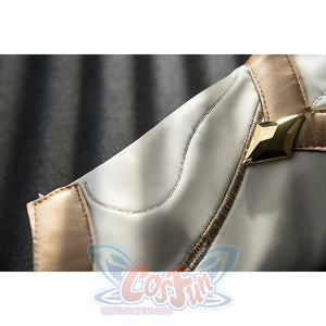 Genshin Impact Noelle cosplay leg guard buckle detail sets gold trim around white armor panels.