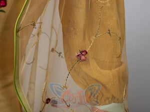Star Wars Padme Amidala cosplay sheer sleeve detail layers vine embroidery and red flower accents.