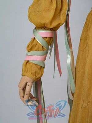 Padmé Amidala cosplay sleeve detail with gathered golden fabric and trailing pastel ribbons.
