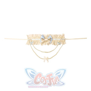 Flat lay of the Bow Pearl Necklace item with blue bow, bow charms, and dangling chain details