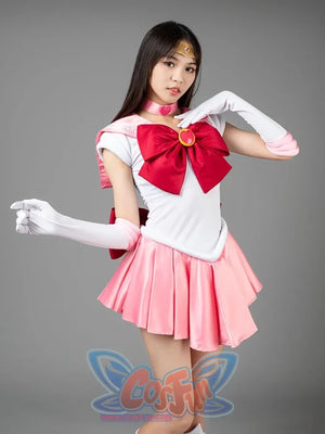 Sailor Chibi cosplay costume styled pose balances the pink bow above soft rose pleats