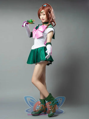 Sailor Jupiter cosplay collar detail frames green trim above the white bodice and pink bow