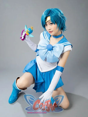 Sailor Mercury cosplay costume styled pose angles the sailor bodice above bright blue pleats