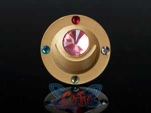 Sailor Moon Usagi Tsukino cosplay brooch close-up highlights a gold-tone frame and red center