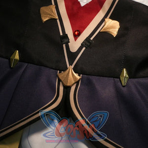 Front panel detail of Sandrone cosplay costume with black fabric, burgundy strap, gold trim, and hanging gold piece