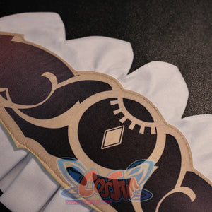 Close-up of Sandrone cosplay costume skirt pattern with black printed motif, beige trim, and white scalloped edge