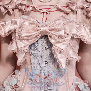 Close-up of the Strawberry Mousse Corset bodice with satin bow, front buttons, and blue ruffle panel