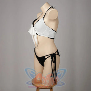 Final Fantasy VII Tifa Lockhart cosplay swimsuit profiles the white front bow above black hip ties.