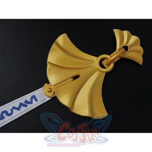 Velina Airgid cosplay hair bow detail focuses on the gold bow accessory and attached white patterned strip.