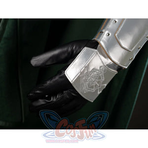 Victor Von Doom cosplay costume highlights the etched wrist guard above a black glove and green cape fold.