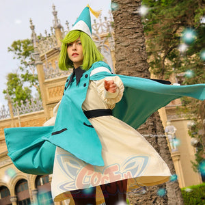 Witch Hat Atelier Coco cosplay costume action view sends the teal cloak flowing behind a cream pleated robe.