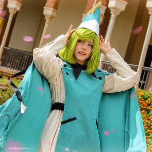 Witch Hat Atelier Coco cosplay costume upper-body view sets the pointed teal hat above a cape and cream sleeves.