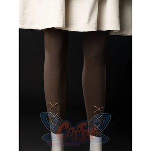 Witch Hat Atelier Coco Tetia Richeh cosplay leggings detail laces brown fabric below the cream robe hem.