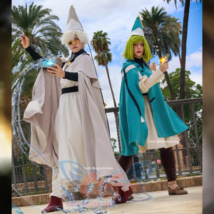Witch Hat Atelier Qifrey and Coco cosplay costumes pair pale and teal capes over matching apprentice robes.