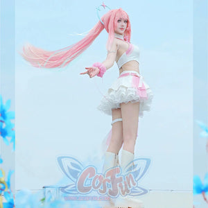 Wuthering Waves Aemeath cosplay costume side view frames the layered skirt beneath a side-waist bow and pale gauze.