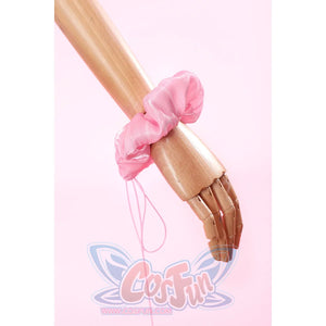 Wuthering Waves Aemeath cosplay bracelet detail wraps a soft pink wrist bow with thin ribbon ties.