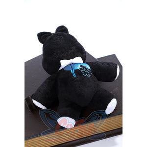 Wuthering Waves Denia cosplay black bear plush front detail presents blue chest embroidery and white paw accents.