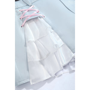 Wuthering Waves Denia cosplay skirt lace-up close-up threads pink cord through silver-tone eyelets and white ruffles.