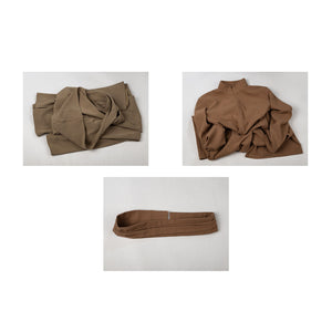 Yoda Master cosplay costume layers the folded brown knit robe with the jumpsuit and waist belt on a soft fabric surface.