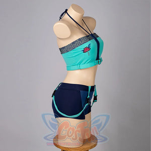 Zoey cosplay tankini side-back view sets a teal cropped top above navy shorts and turquoise straps.