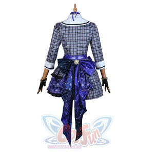hololive Virtual YouTuber Hoshimachi Suisei cosplay back view anchors deep blue waist bow over plaid dress.