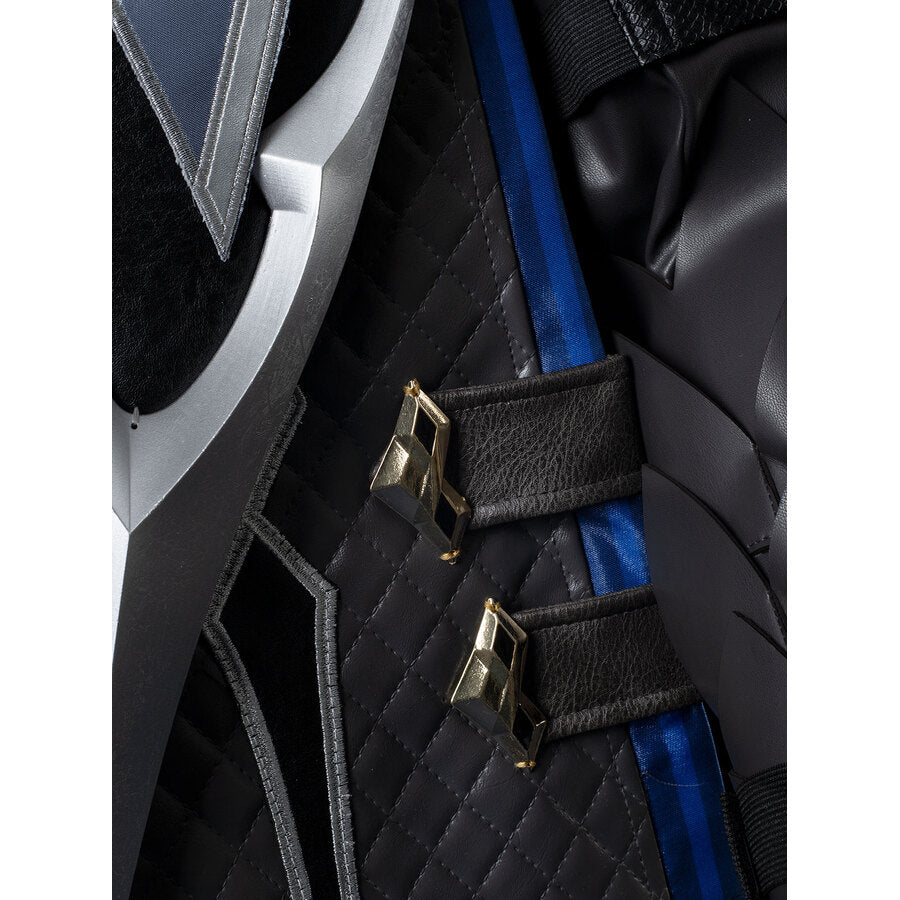 Genshin Impact Il Capitano cosplay coat section anchors silver shoulder armor above deep blue sash and gold clasps.