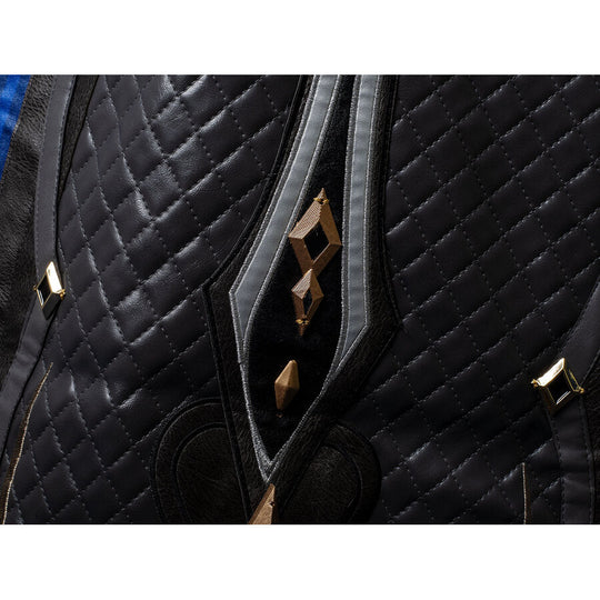 Genshin Impact Il Capitano cosplay garment balances quilted black fabric against grey borders and gold geometric accents.