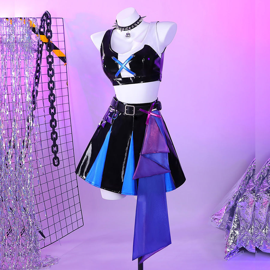 Guinevere punk costume with black, blue, and purple color-block design featuring a shiny black sleeveless crop top and matching patched mini skirt.