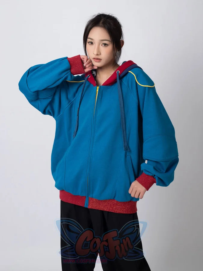 Woman in blue Homelander cosplay jacket posing, showing oversized fit and design details