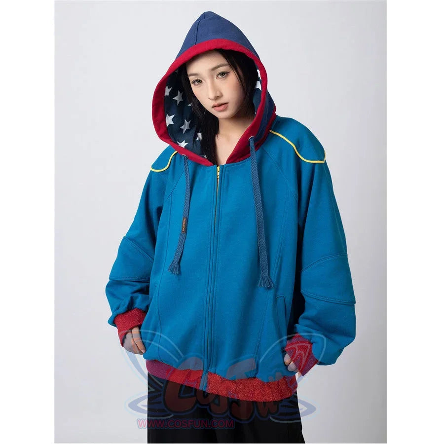 Woman modeling blue Homelander cosplay jacket with hood up, star-lined interior visible