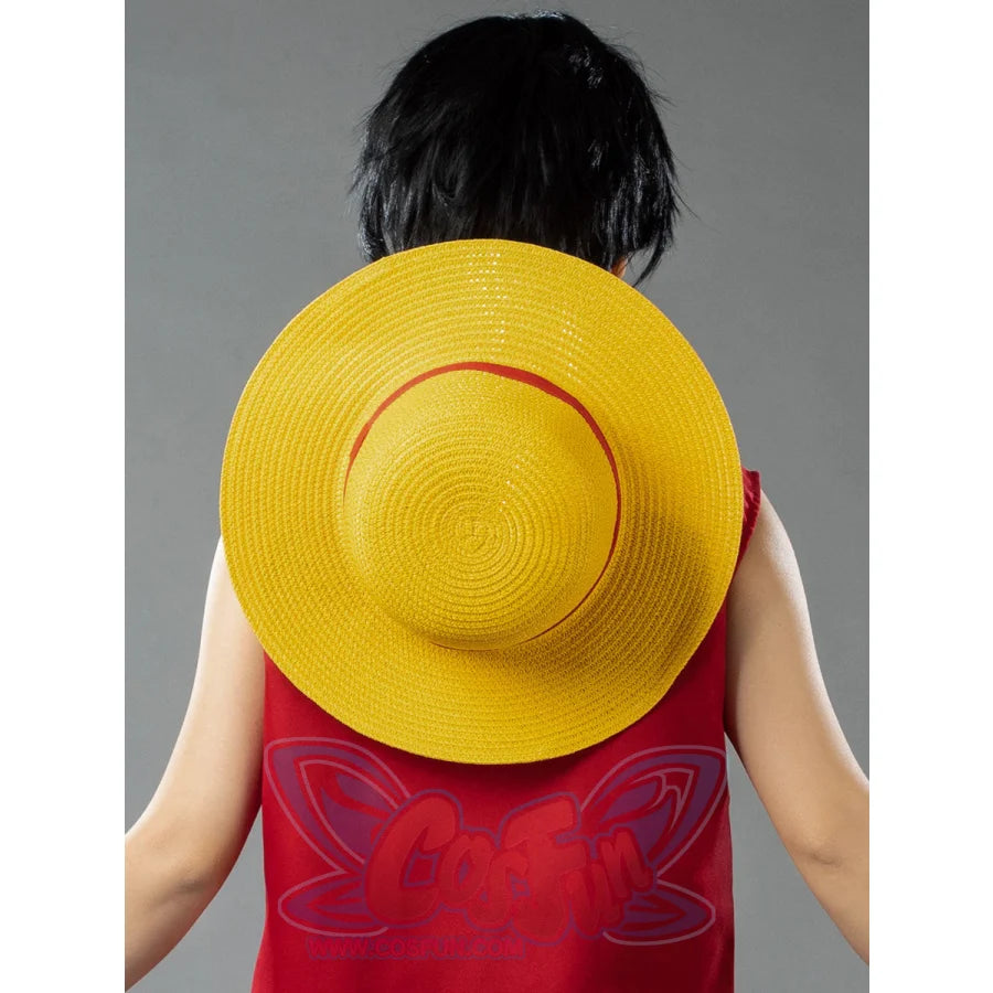 Japanese Anime Monkey D. Luffy cosplay straw hat sets a red ribbon band against yellow woven papyrus.
