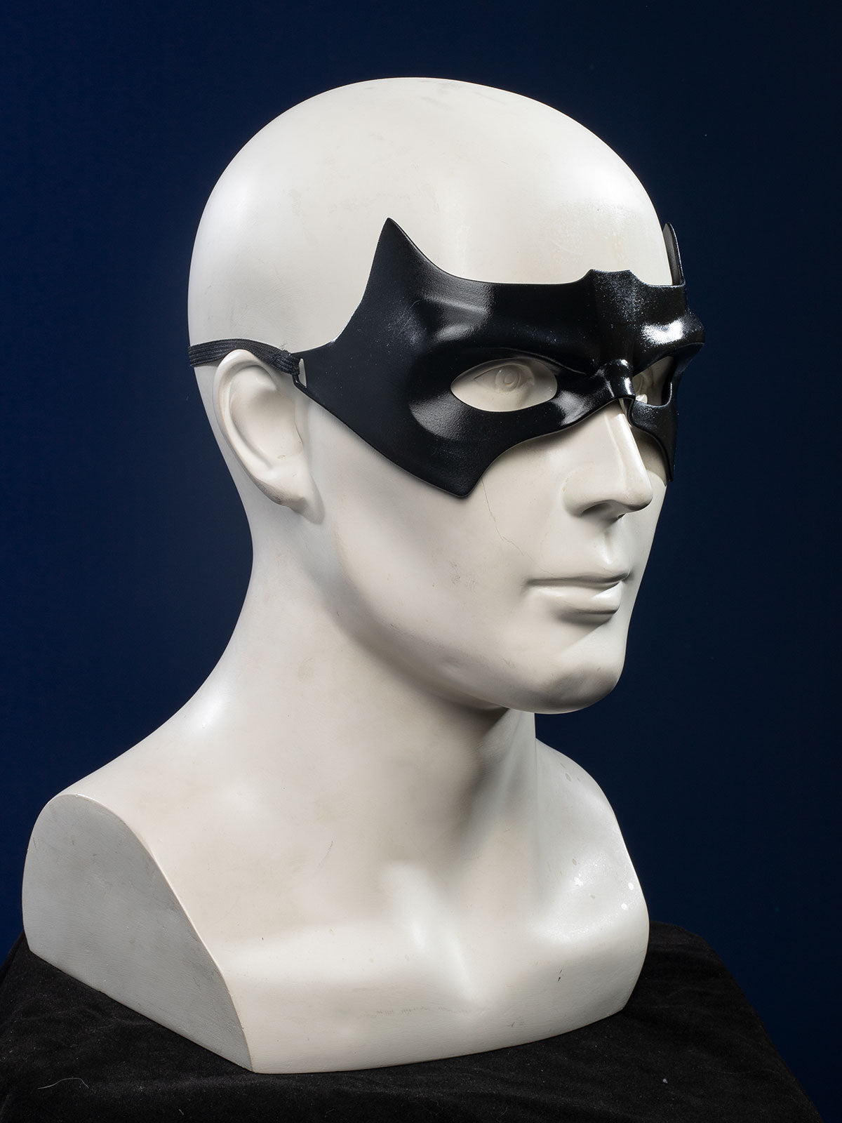 Nightwing cosplay costume - Eye mask side view with wing-shaped design and strap