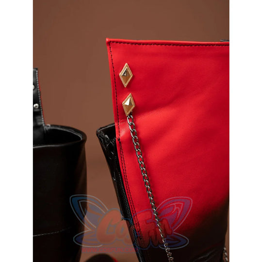 Genshin Impact Tartaglia Childe cosplay boot framing a red cuff with gold diamond accents and a cascading metal chain detail.