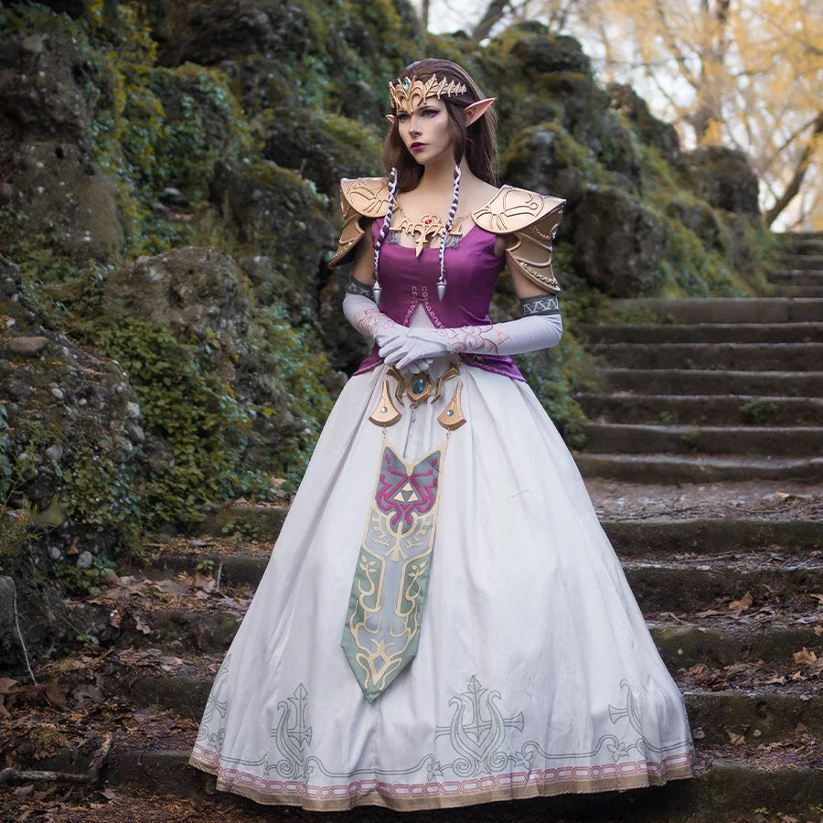 COSFUN Twilight Princess Zelda cosplay dress layers jeweled tiara above gold pauldrons and embroidered white skirt.