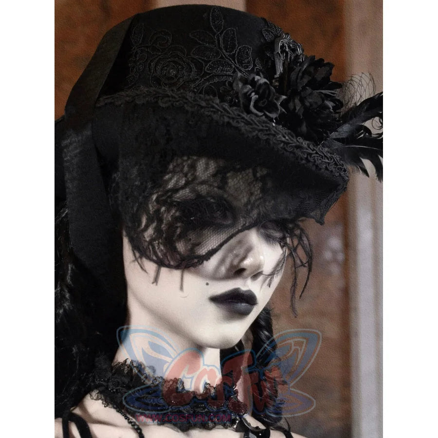 Side profile view of the black Gothic Victorian flat-top hat with embroidered rose pattern and black feather embellishments