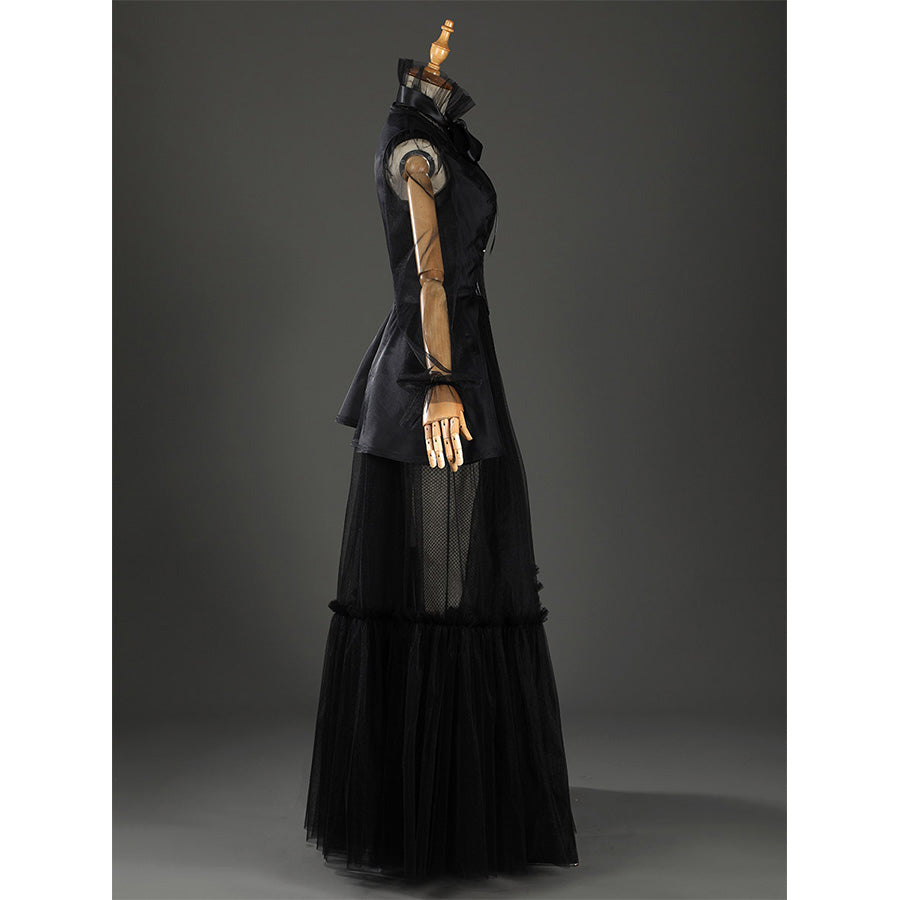 Addams black evening dress with arms raised showcasing full silhouette and sleeves